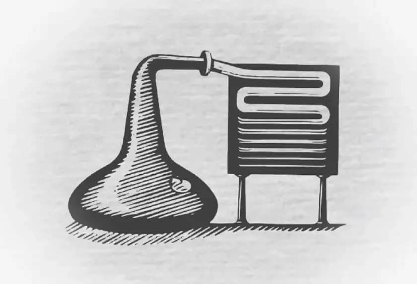 Vintage distillation apparatus with a retort connected to a condenser.